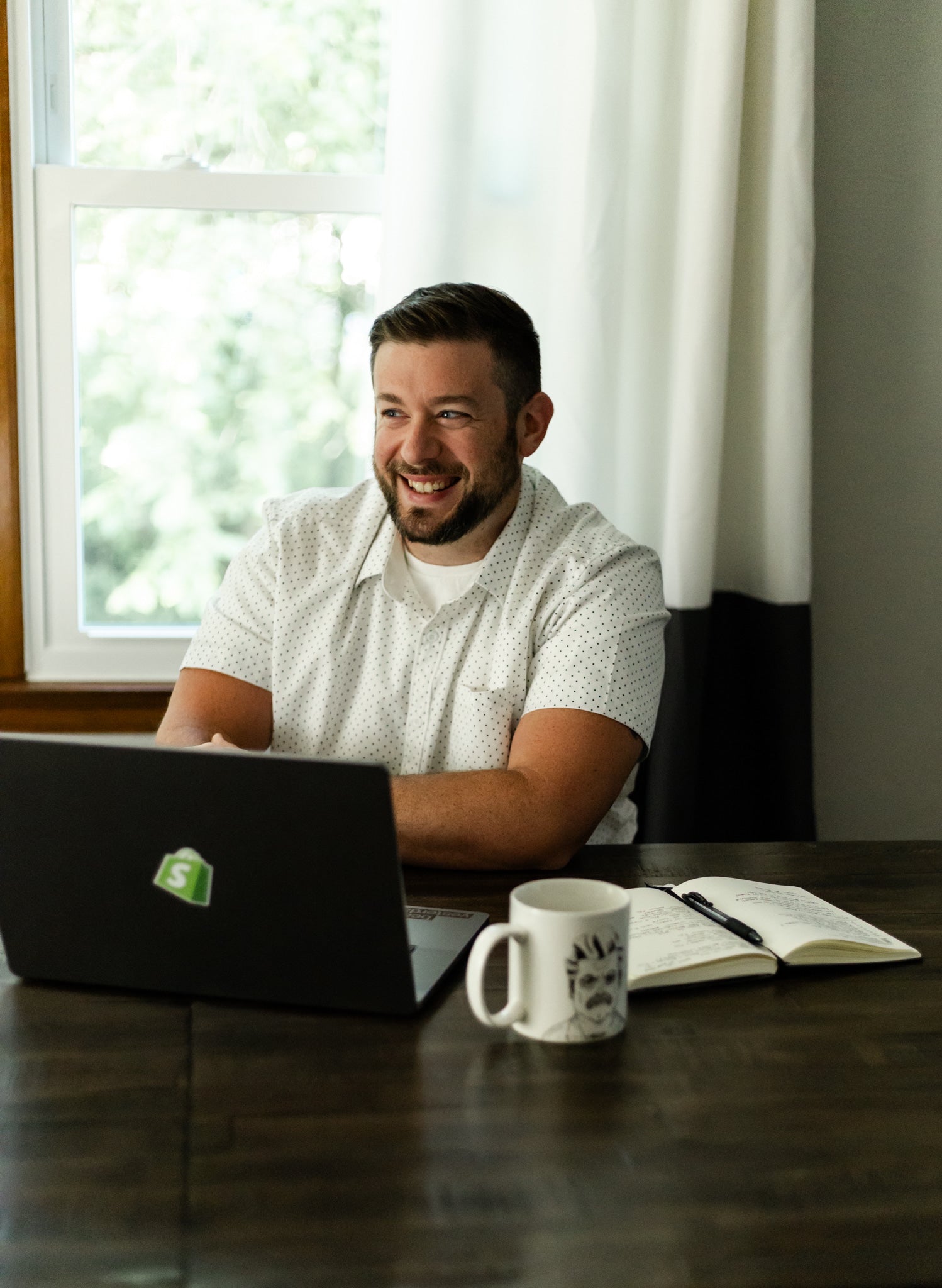Taylor with computer and mug